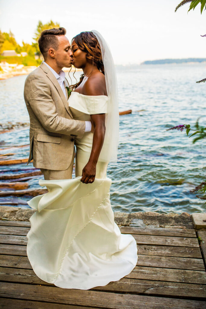 Groom and bride kissing after their Bohemian wedding in Vancouver BC