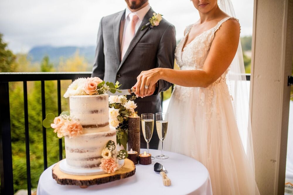 Cutting the cake at an intimate backyard wedding in Maple Ridge BC
