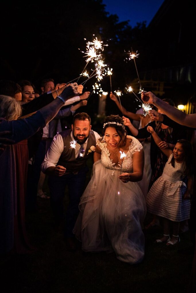 Lighting sparklers after a backyard wedding ceremony in BC