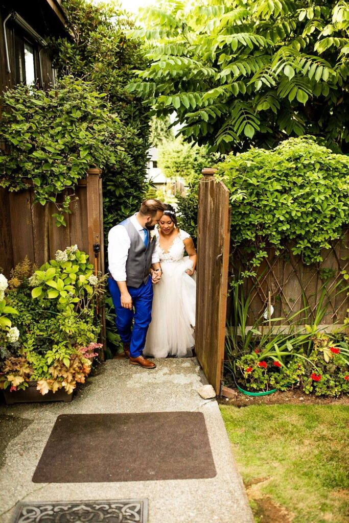 Bride and groom exiting their backyard wedding ceremony in BC
