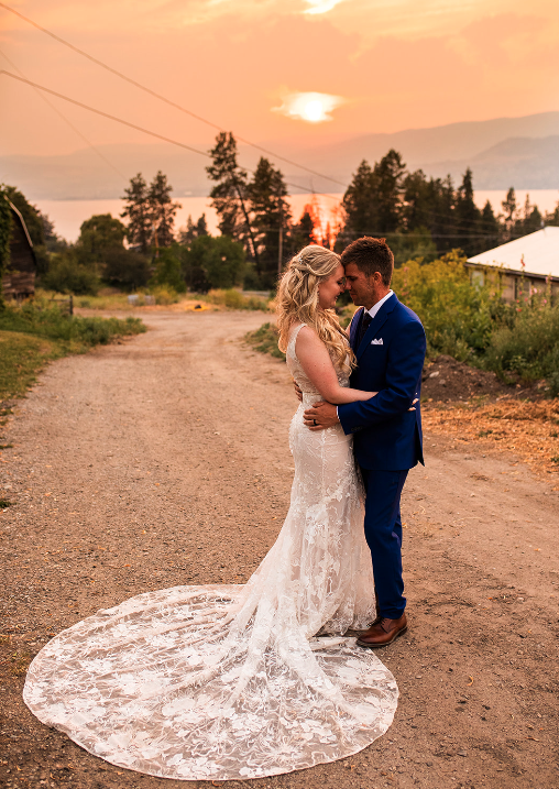 Couple embracing at their Okanagan wedding outdoors