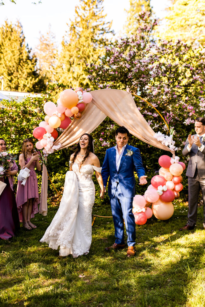 Colorful outdoor wedding venue in Vancouver with newlyweds