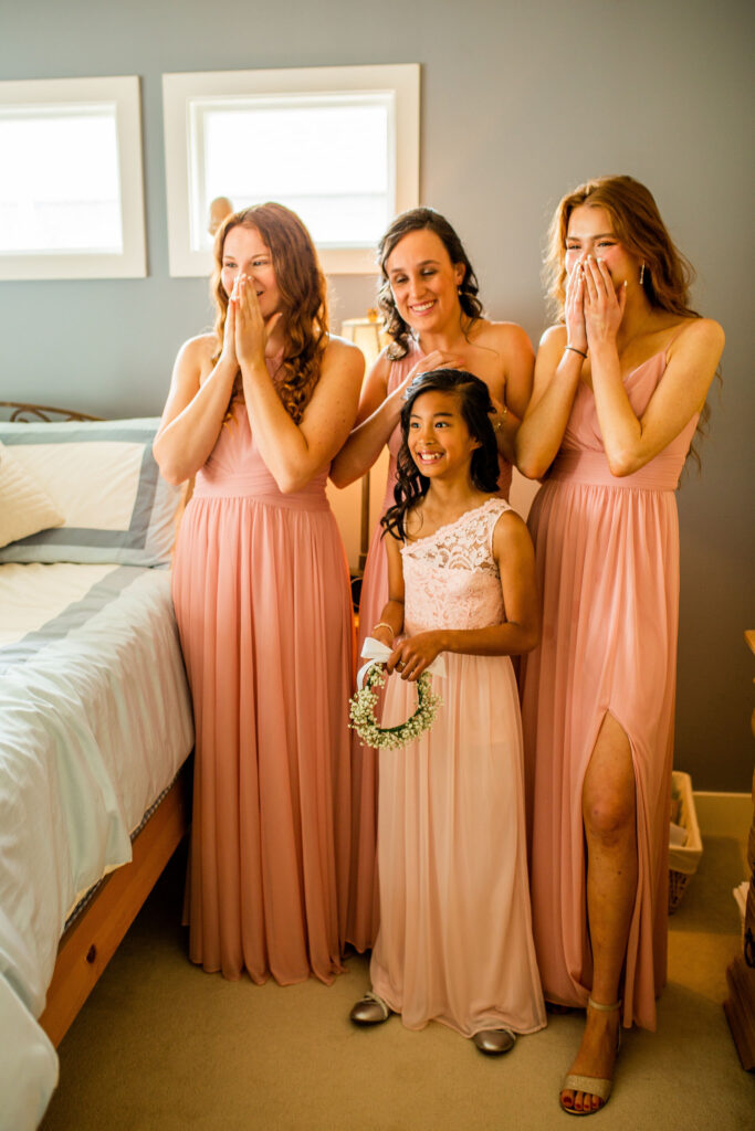 Bridesmaids surprised at gorgeous bride before her Redwoods Golf Course Wedding
