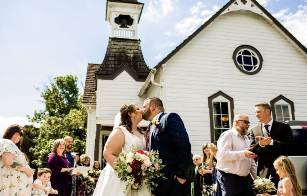 Vancouver wedding photo of couple kissing outside chapel