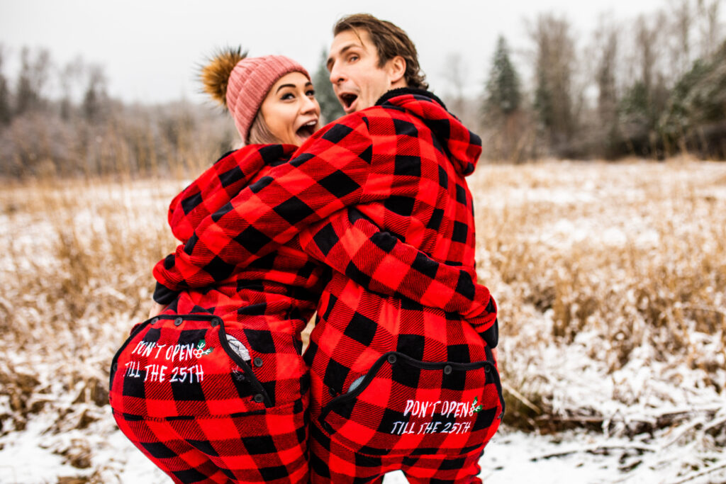 Go for matching Christmas sweaters for your winter photoshoot in the snow