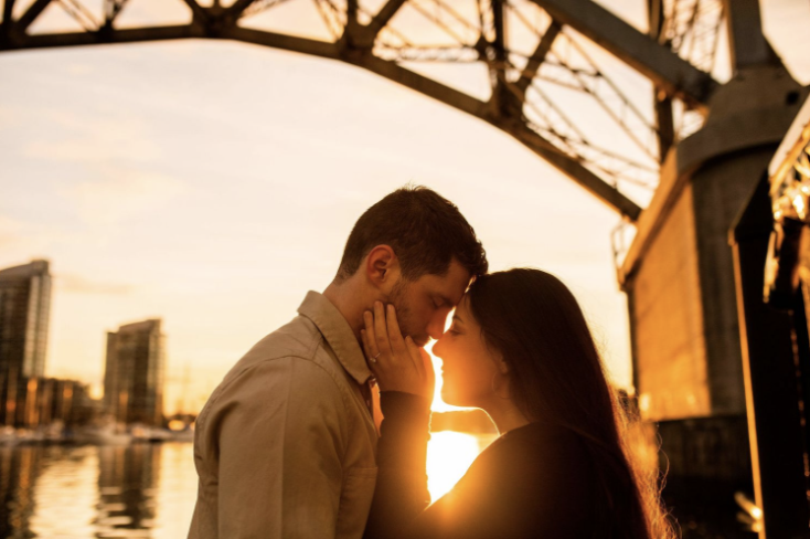 Couples photoshoot at sunset under a bridge
