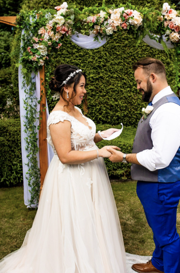 Exchanging vows in backyard wedding ceremony in BC