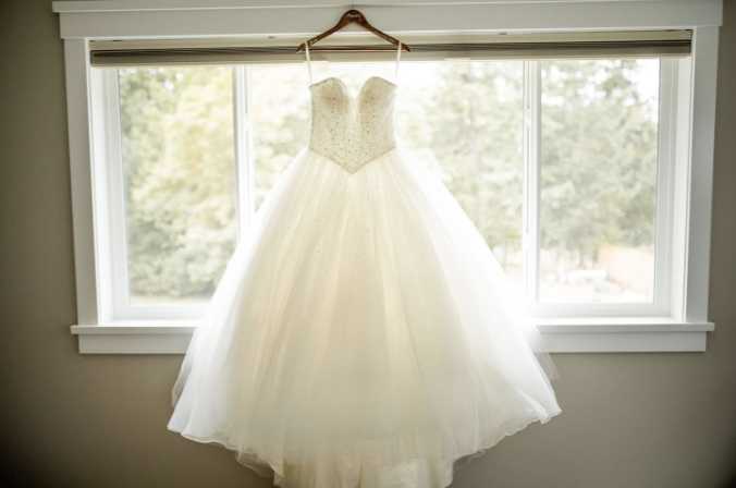 Tips for your getting ready photos - have your wedding dress hanging for photos