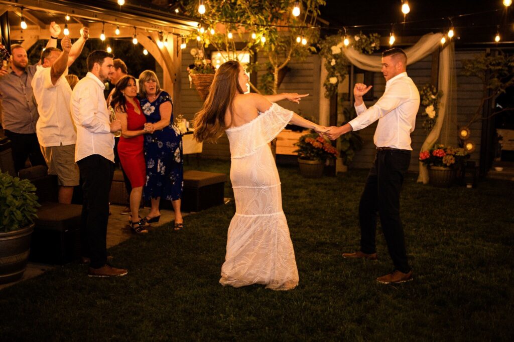 Couple dancing at their backyard wedding reception

