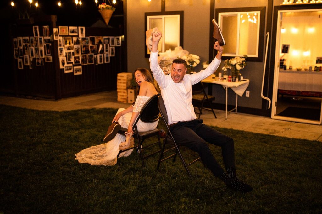 Bride and groom laughing at their intimate backyard wedding