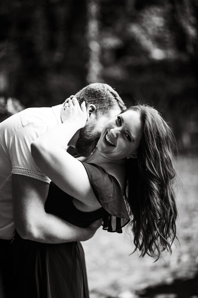 Black and white couples portrait embracing during their engagement shoot in Vancouver