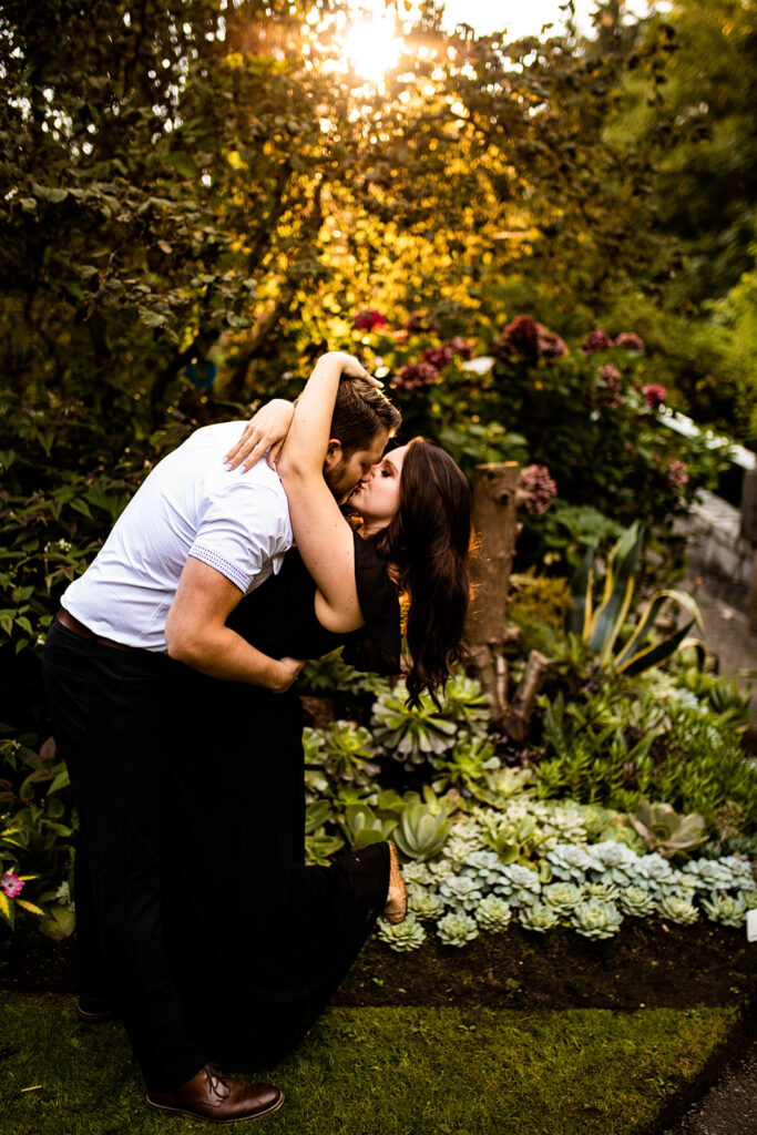 Couple kissing in a park engagement shoot in Vancouver