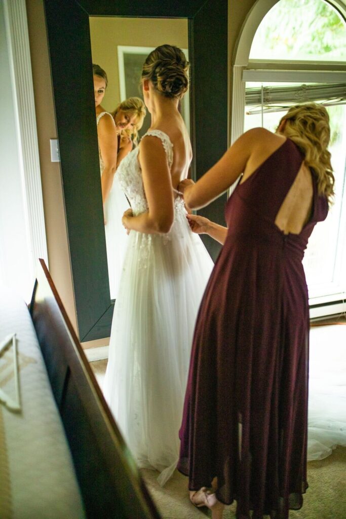 Bride putting on her dress at an intimate backyard wedding in Maple Ridge BC