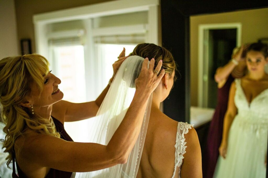 Bride putting on veil before her intimate backyard wedding in Maple Ridge BC
