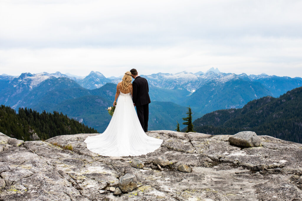 Romantic wedding portrait on top of a mountain at their heli wedding