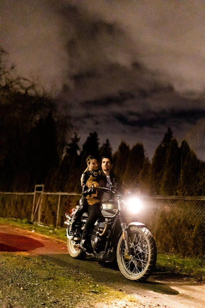 Couple riding a motorcycle during their engagement shoot in Vancouver