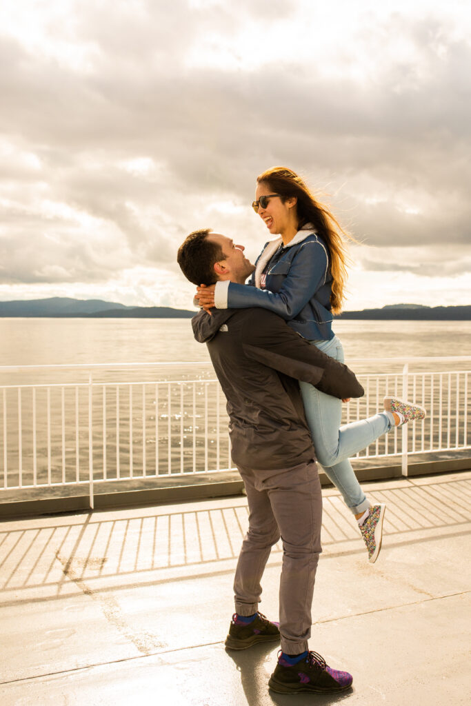 Couple embracing during a photoshoot on Victoria ferry in Canada