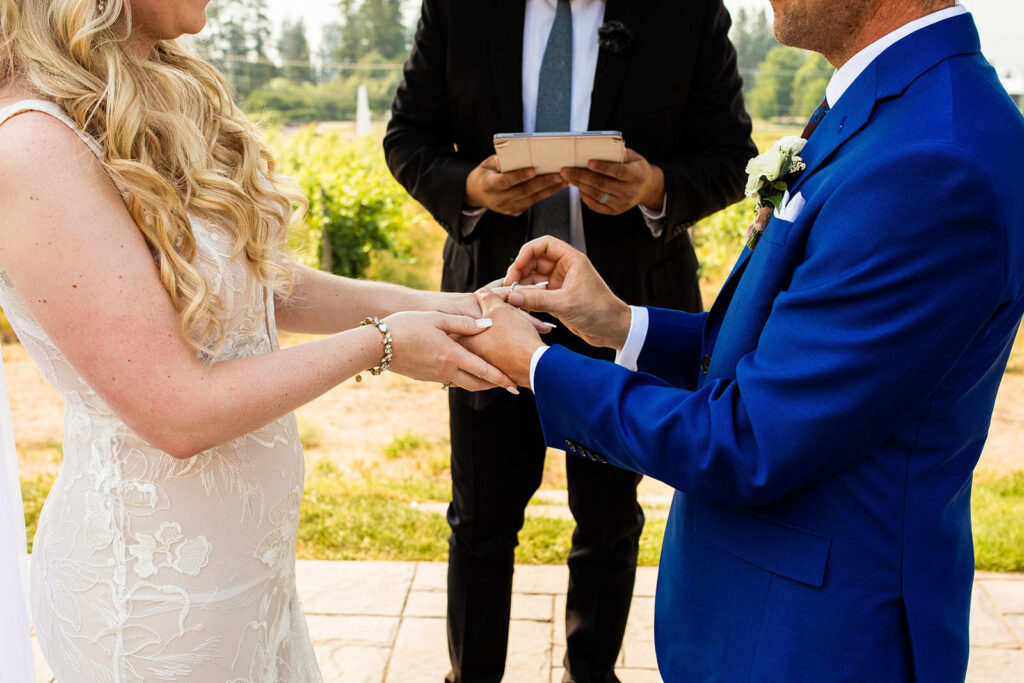 Exchanging rings at a Kelowna wedding