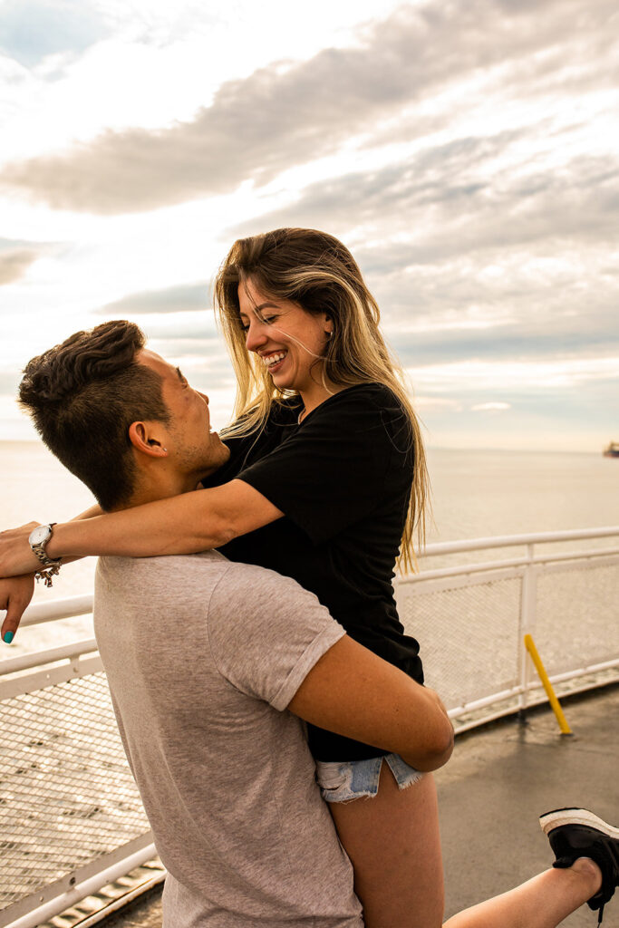 Couple laughing on a photoshoot on Victoria ferry in Canada