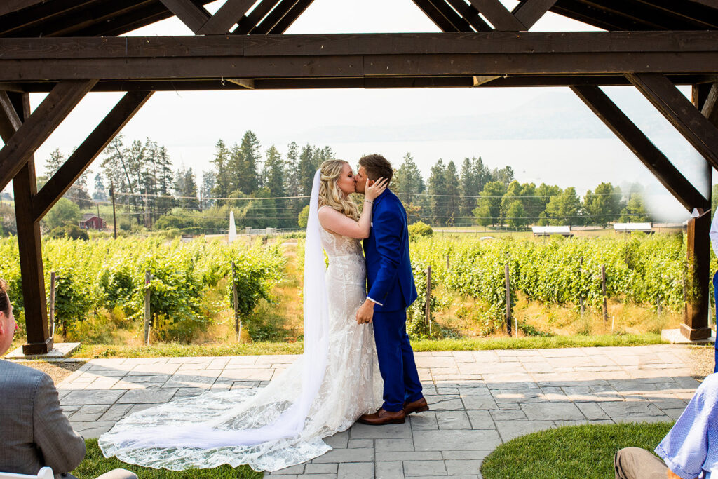 Couple kissing at their Summerhill Pyramid Winery wedding