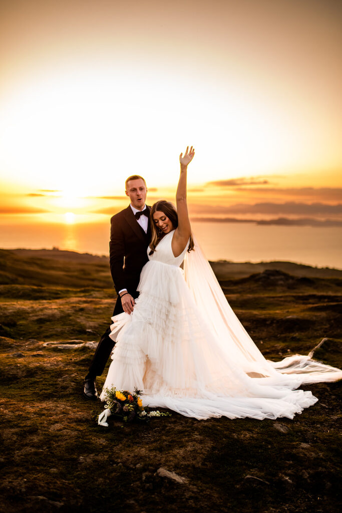 Sunset photo of happy newlyweds 