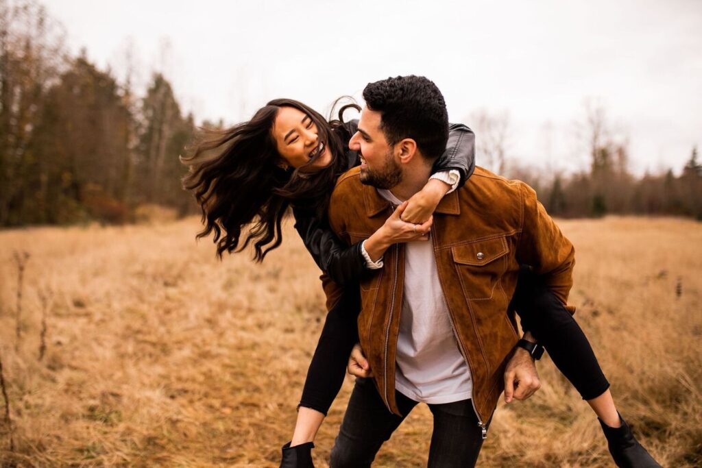 Piggyback ride during an engagement shoot Vancouver BC