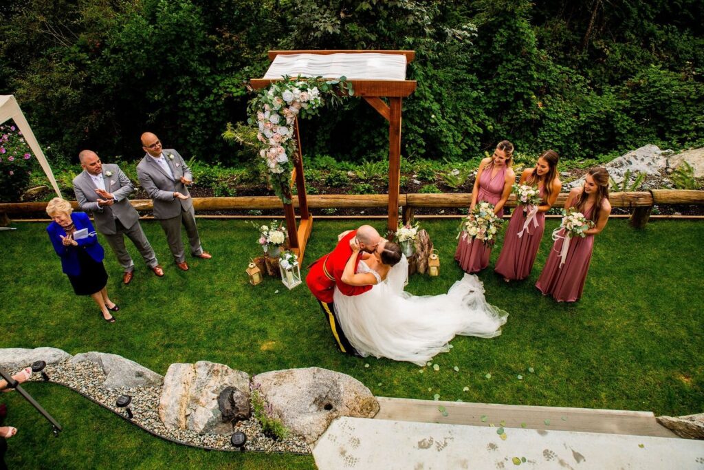 Kissing the bride at a Backyard wedding in BC