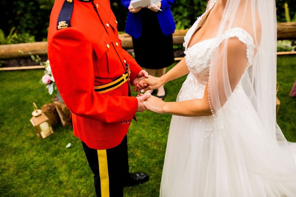 Detail of bride and groom holding hands during an intimate backyard wedding in Maple Ridge BC