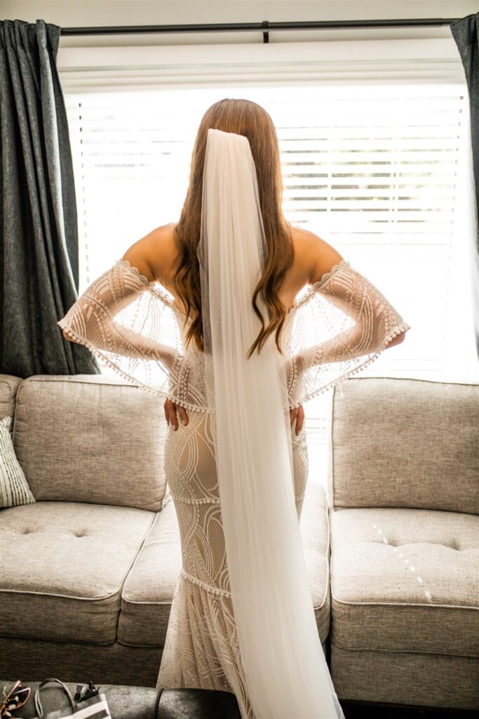 Bridal dress from the back at her intimate backyard wedding 
