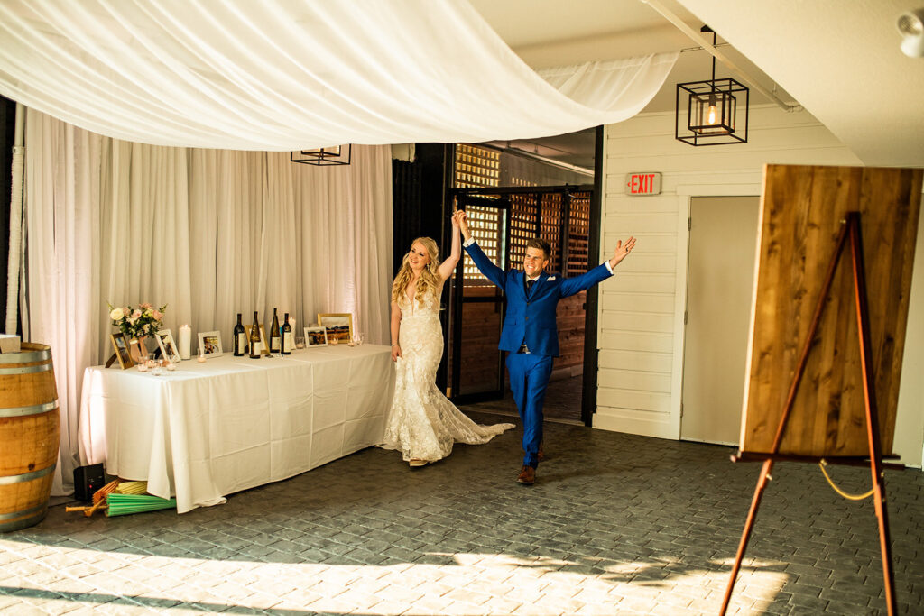 Newlyweds entering the reception at their Kelowna wedding reception