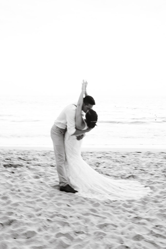 Black and white photo of couple kissing at their Cabo San Lucas wedding