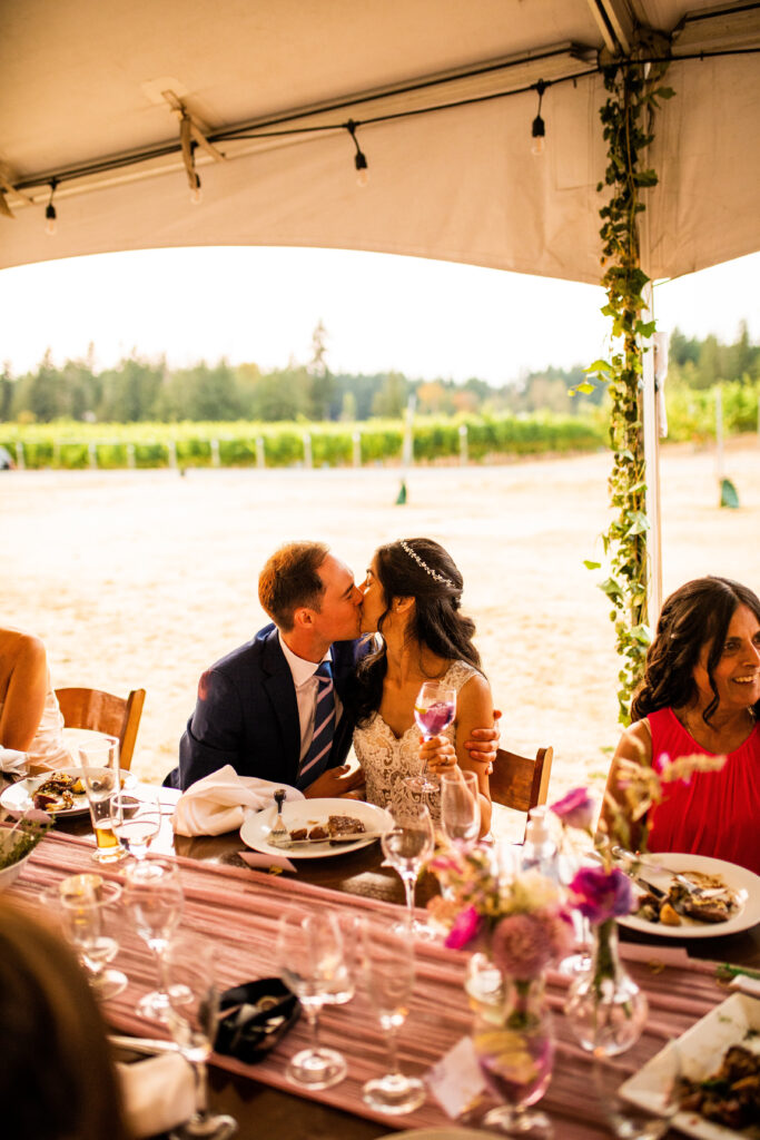 Newlyweds kissing Vancouver Island Wedding At Enrico Winery