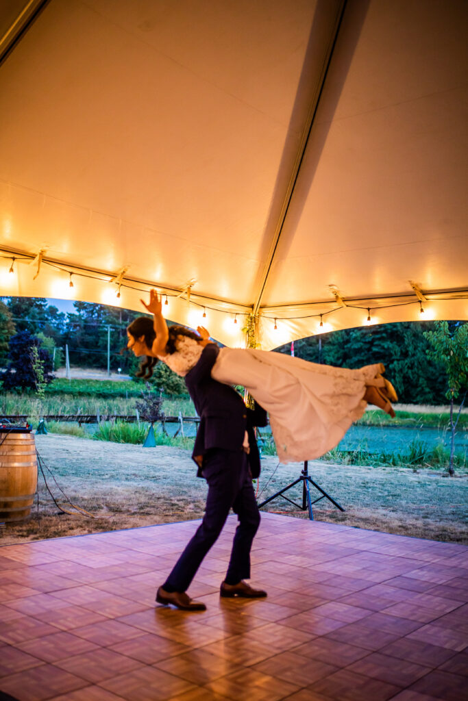 Groom dancing with bride Vancouver Island Wedding At Enrico Winery