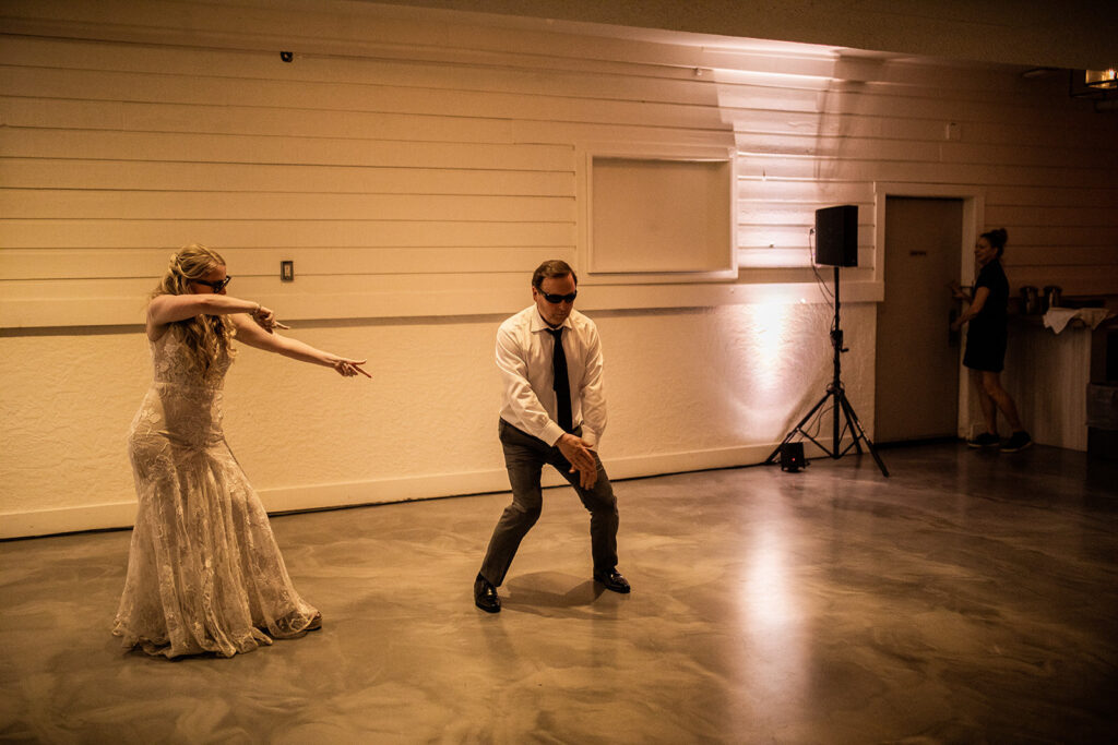 A guest dancing with sunglasses at a Kelowna wedding
