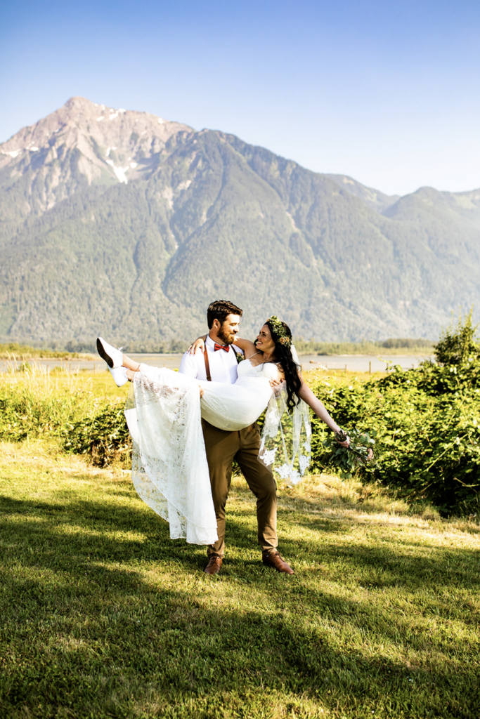 Groom dipping the bride at their Fraser Ridge Lodge wedding