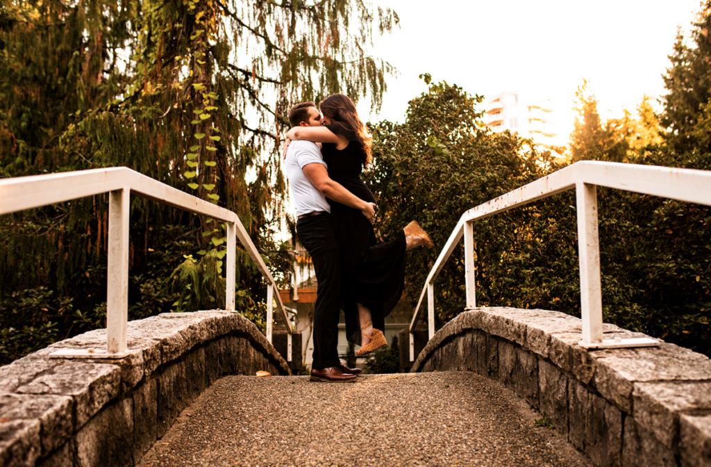 Couple kissing on a bridge in BC
