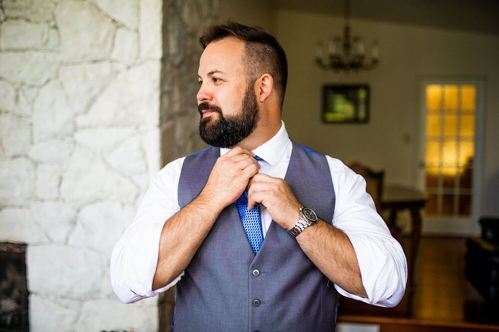 Groom getting ready for his backyard wedding ceremony in BC