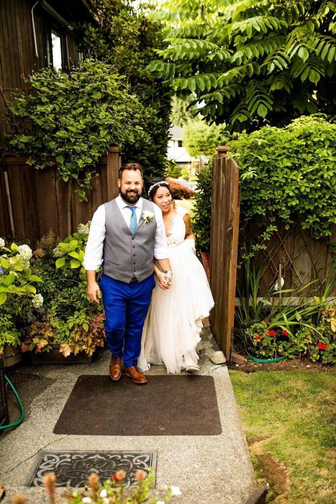 Couple exiting their backyard wedding in BC